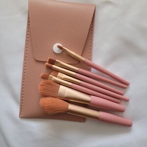 Travel size makeup brushes.